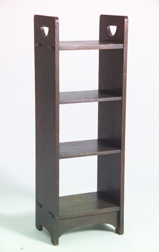 Appraisal: GUSTAV STICKLEY Magazine stand with D-shaped cut-out handles and four