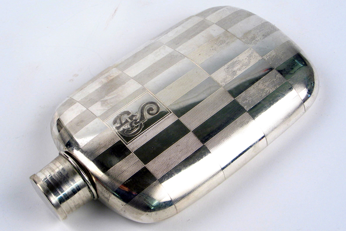 Appraisal: A STERLING SILVER POCKET FLASK with screw-off jigger lid -