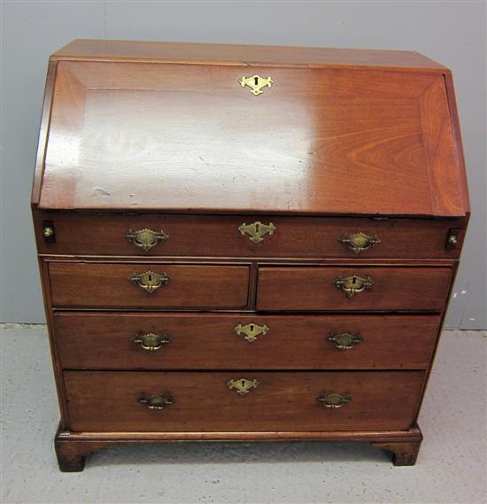 Appraisal: George III mahogany bureau the interior with well drawers pigeon