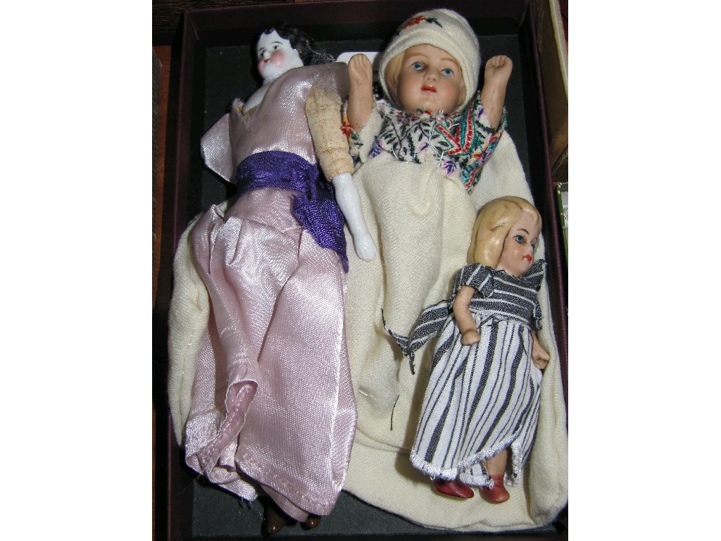 Appraisal: Lot comprising three miniature dolls