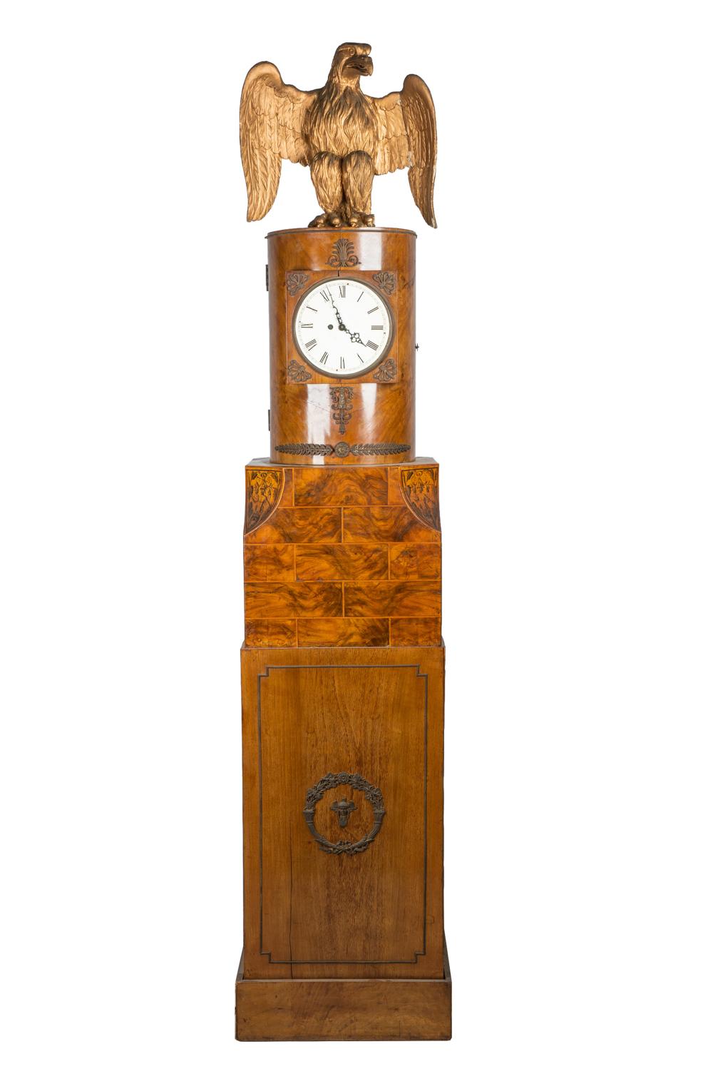 Appraisal: MAHOGANY BURL PEDESTAL CLOCKsurmounted by a carved giltwood eagle with