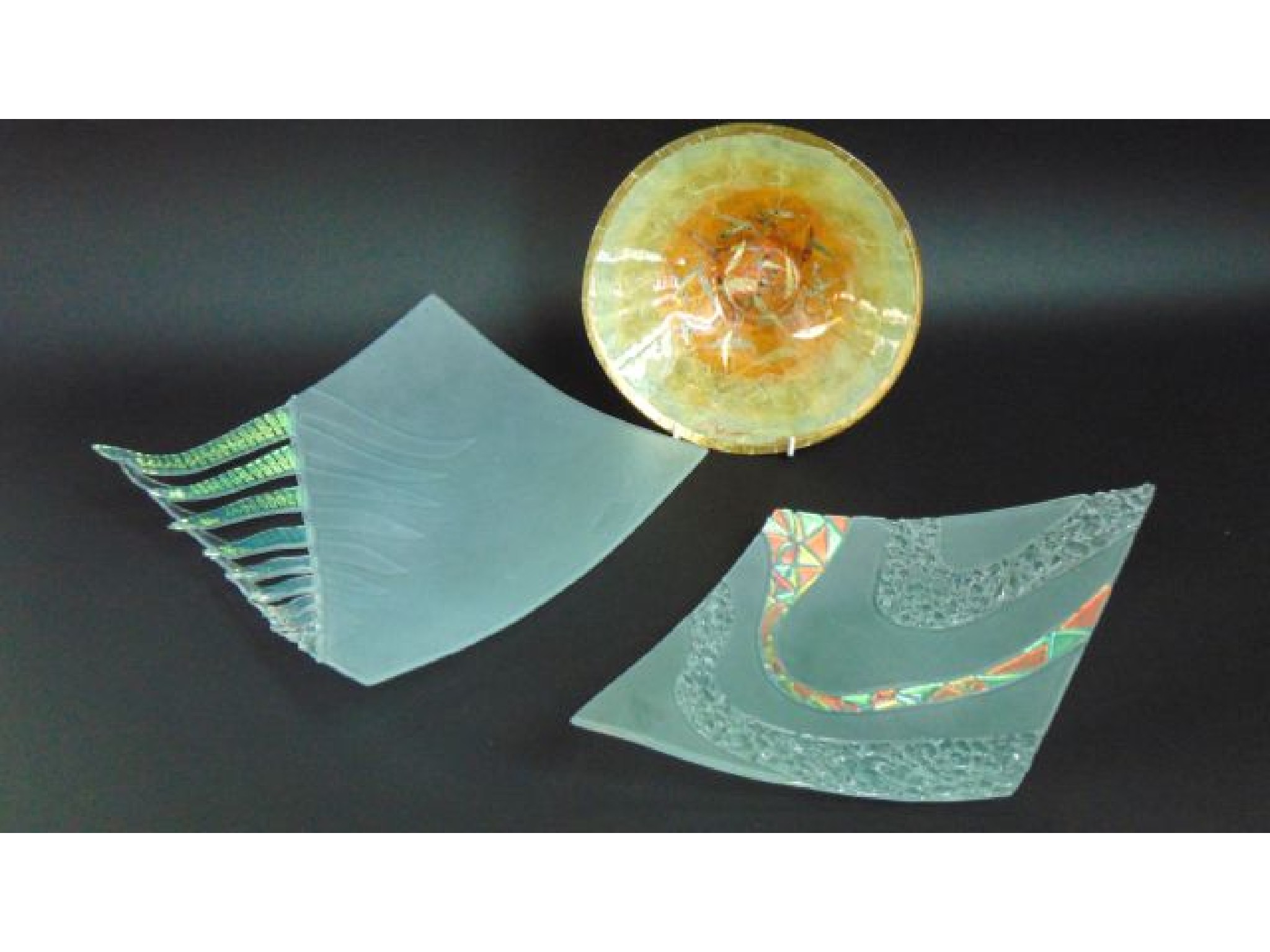 Appraisal: A frosted studio glass dish of kite form with fused