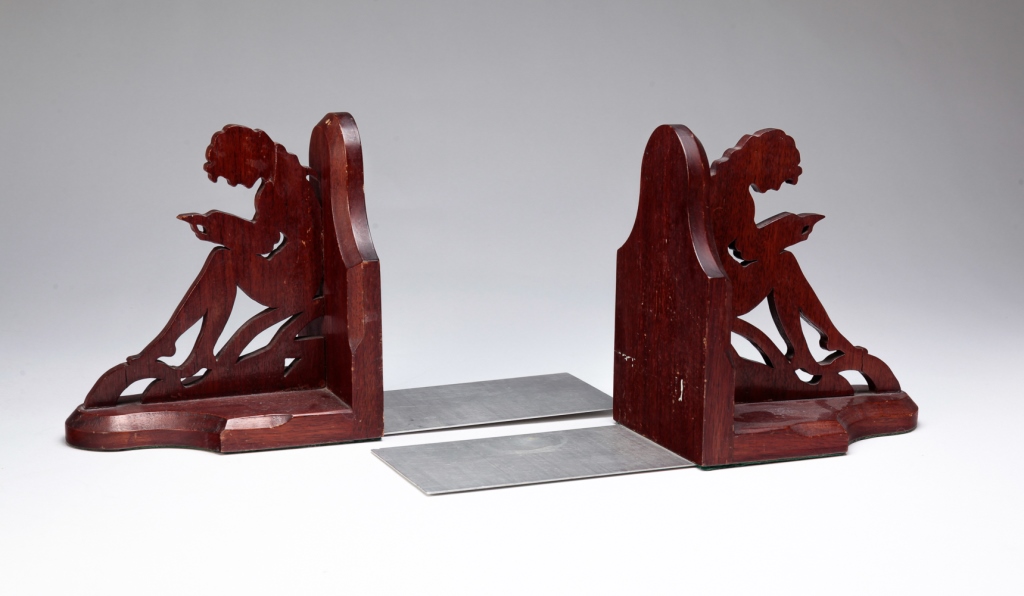 Appraisal: PAIR OF AMERICAN WOODEN BOOKENDS Ca s Jigsaw cut figures