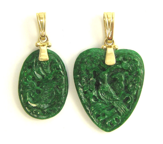 Appraisal: TWO GREEN JADE AND YELLOW GOLD PENDANTS each having a