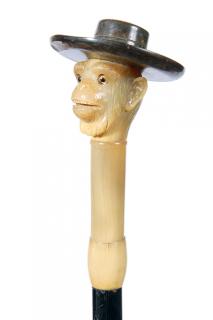 Appraisal: Horn Monkey Dress Cane-Ca - A realistic carved monkey with