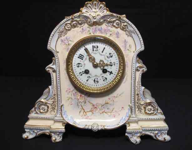 Appraisal: A Royal Bonn floral decorated porcelain mantle clock with Japy