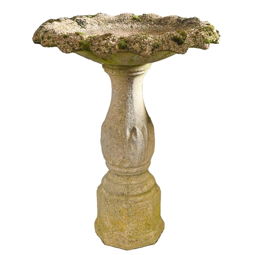 Appraisal: A reconstituted campana shaped garden urn on pedestal a concrete