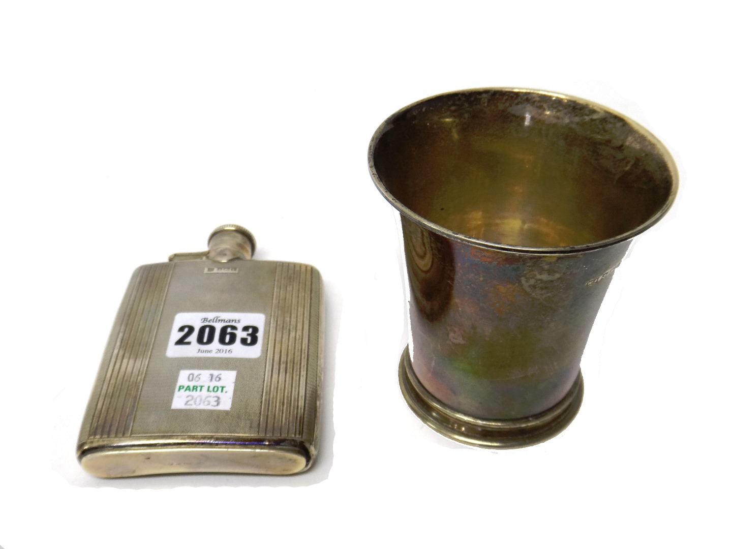 Appraisal: Silver comprising a rectangular spirit flask having engine turned decoration