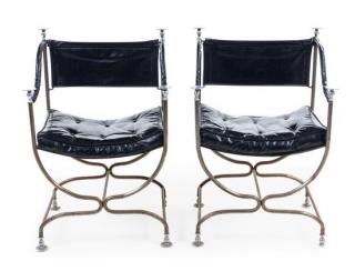 Appraisal: A Pair of Steel and Leather Campaign Style Armchairs Height