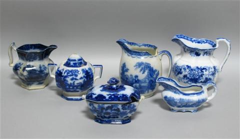 Appraisal: THREE VARIOUS FLOW BLUE JUGS Late th century including one