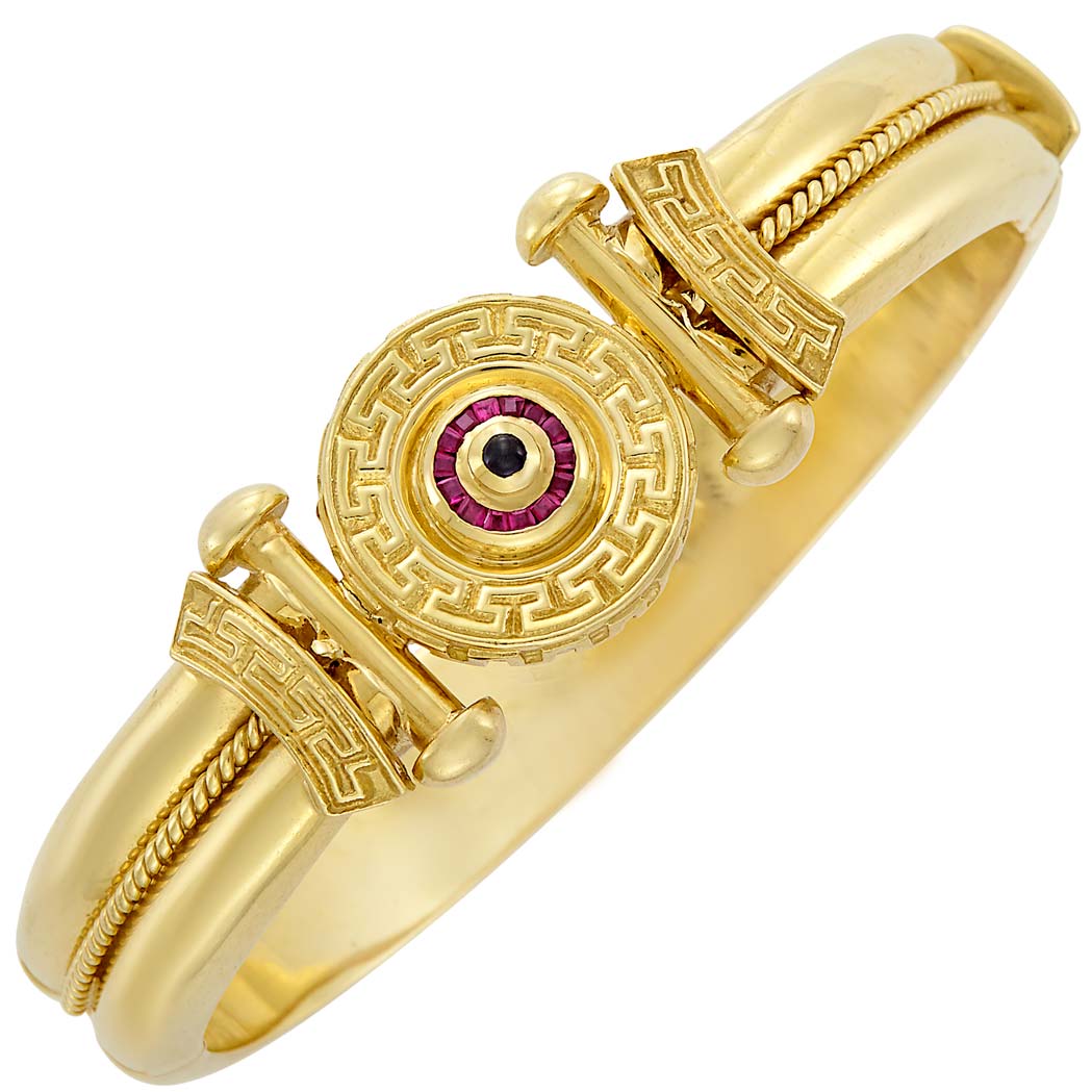 Appraisal: Gold Ruby and Cabochon Sapphire Bangle Bracelet kt ap dwts