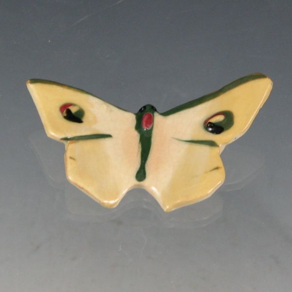 Appraisal: Weller butterfly figure in yellow green and mauve Unmarked There