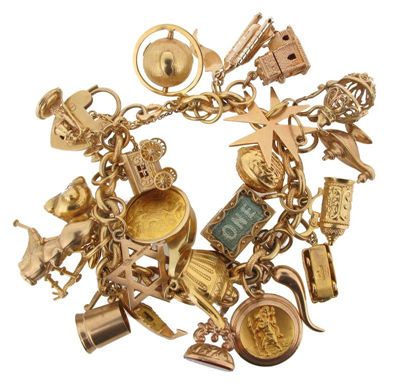 Appraisal: A gold charm bracelet The gold bracelet of alternating plain