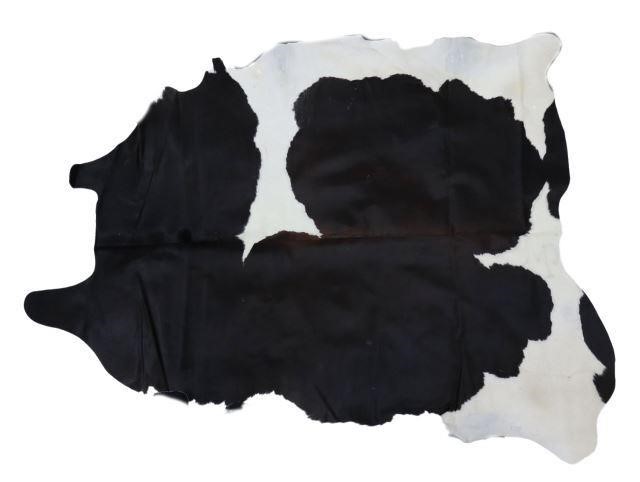 Appraisal: Black and white cowhide largest measurements approx x