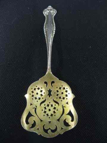 Appraisal: Victorian Sterling Silver Tomato Server elaborate gold washed pierced end