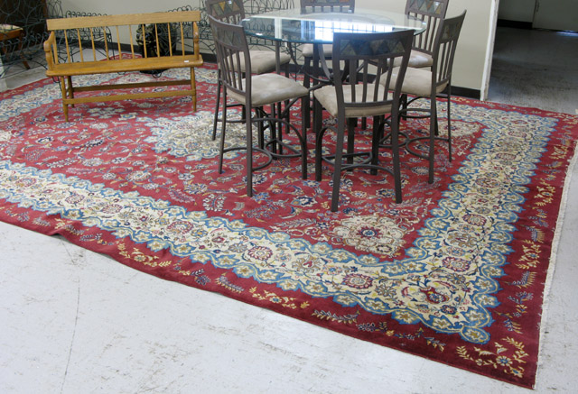 Appraisal: PERSIAN SAROUK CARPET floral and floral medallion design on red