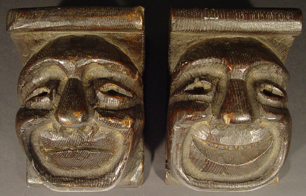 Appraisal: Two oak wall brackets carved with grotesque faces each cm