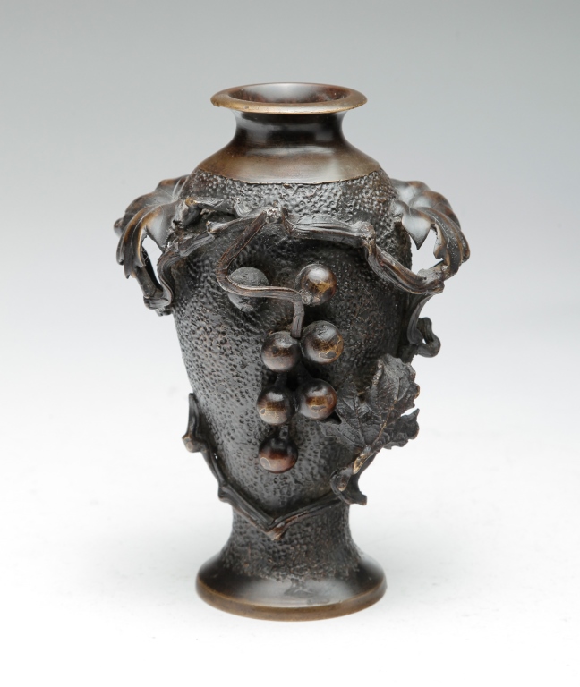 Appraisal: Late th-early th century bronze Cast with vase grape detail