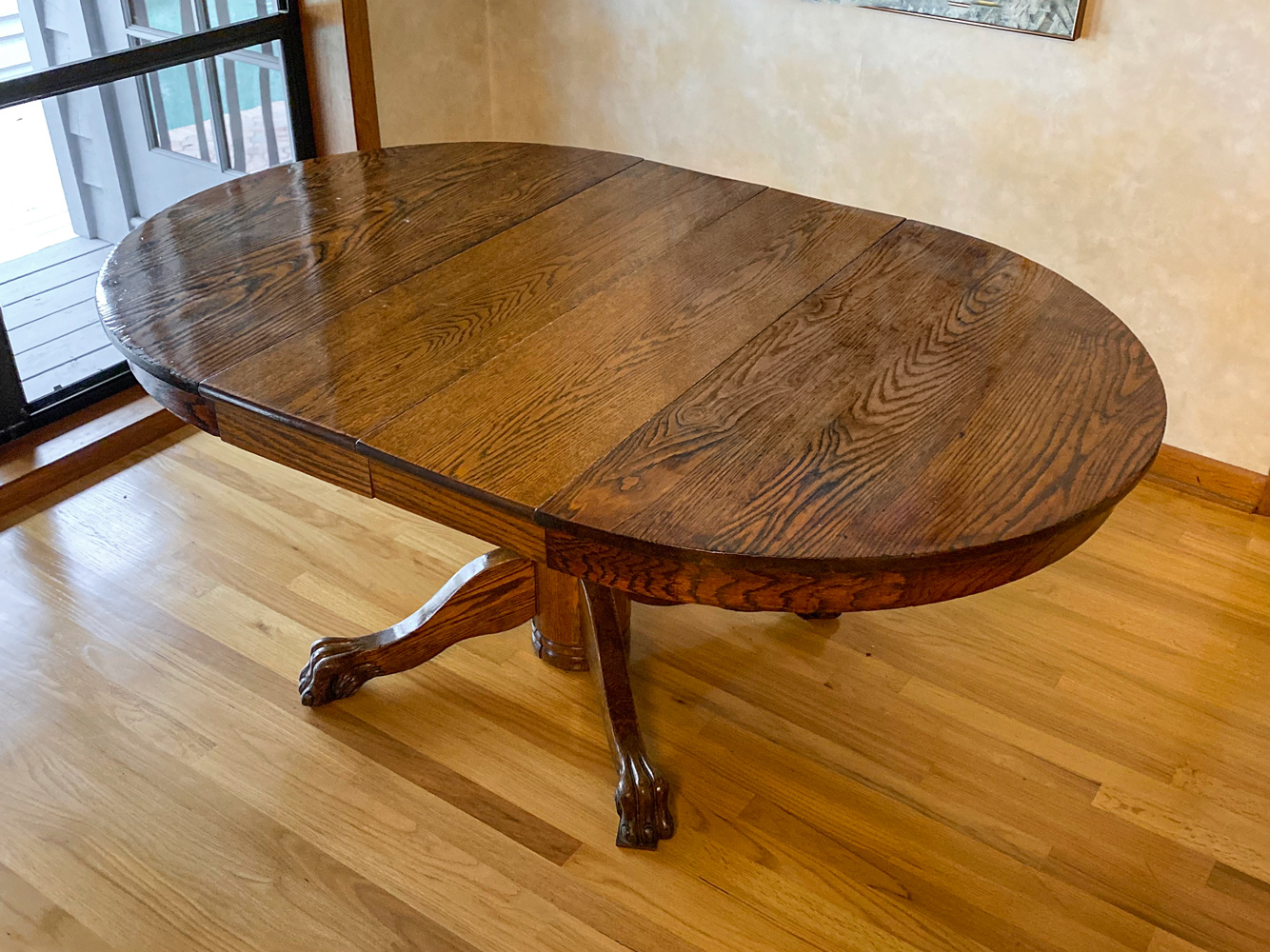 Appraisal: OAK DINING TABLE WITH TWO LEAVES Oak dining table raised