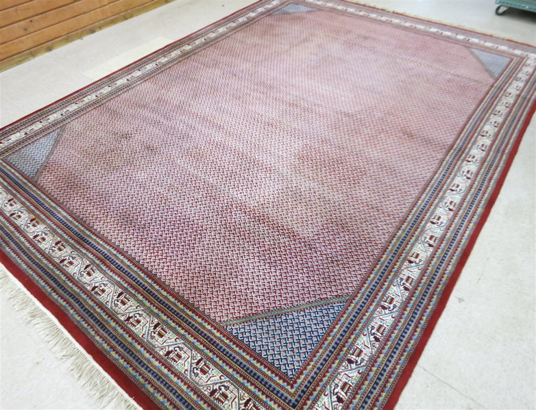 Appraisal: HAND KNOTTED ORIENTAL CARPET Indo-Persian Mir Seraband pattern on red