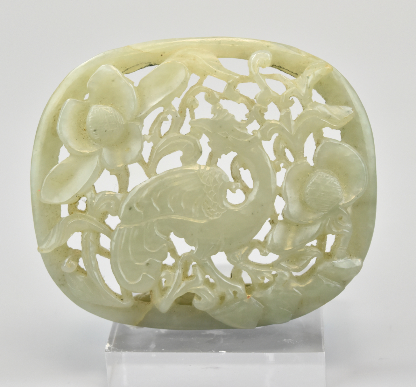 Appraisal: An oval shaped Chinese white jade pendant with a floral