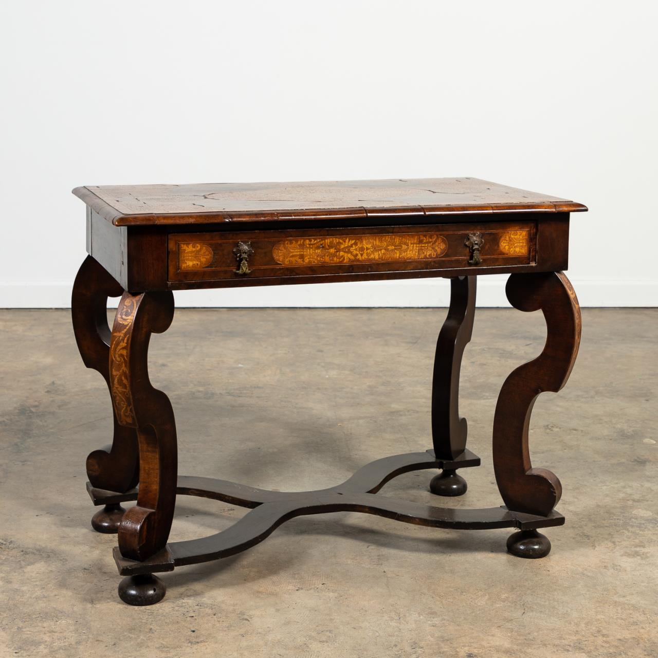 Appraisal: L TH C BAROQUE STYLE SEAWEED MARQUETRY TABLE Continental likely