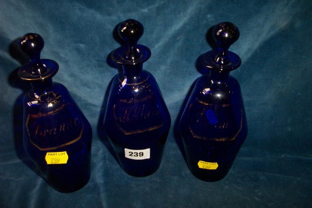 Appraisal: Three th century cobalt blue glass decanters and stoppers with