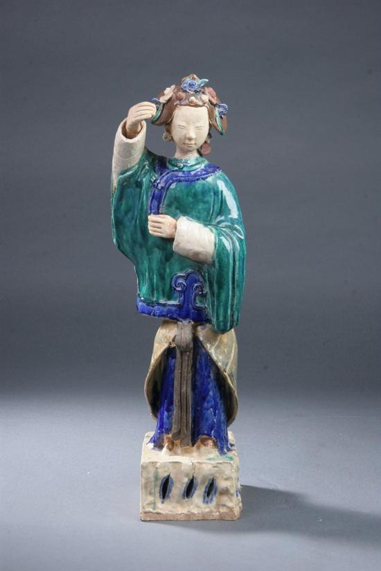 Appraisal: CHINESE POLYCHROME POTTERY FIGURE OF COURT LADY Standing painted with