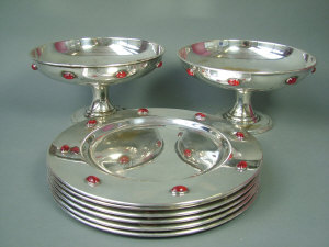 Appraisal: A pair of Scottish silver plated comports six plate coasters