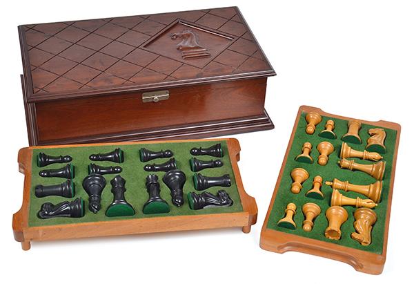 Appraisal: A CHESS SET IN A MAHOGANY BOXthe box lid carved