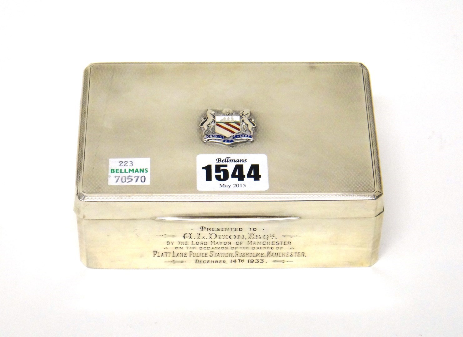 Appraisal: A rectangular silver cigarette box Birmingham the engine turned cover