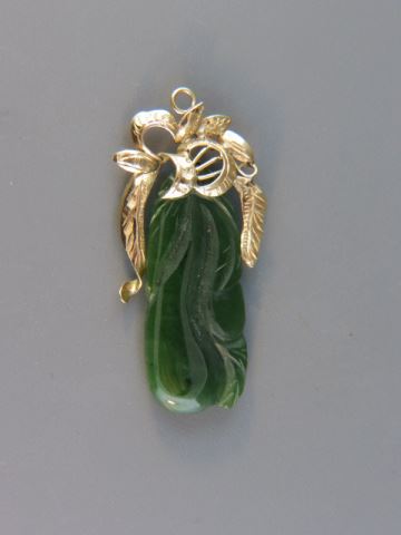 Appraisal: Chinese Carved Jade Pendant k yellow gold top plum style