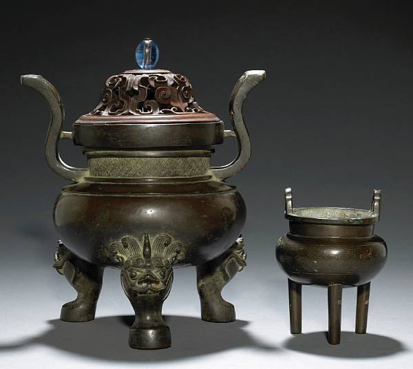 Appraisal: Two bronze tripod censers Qing Dynasty The larger heavily cast