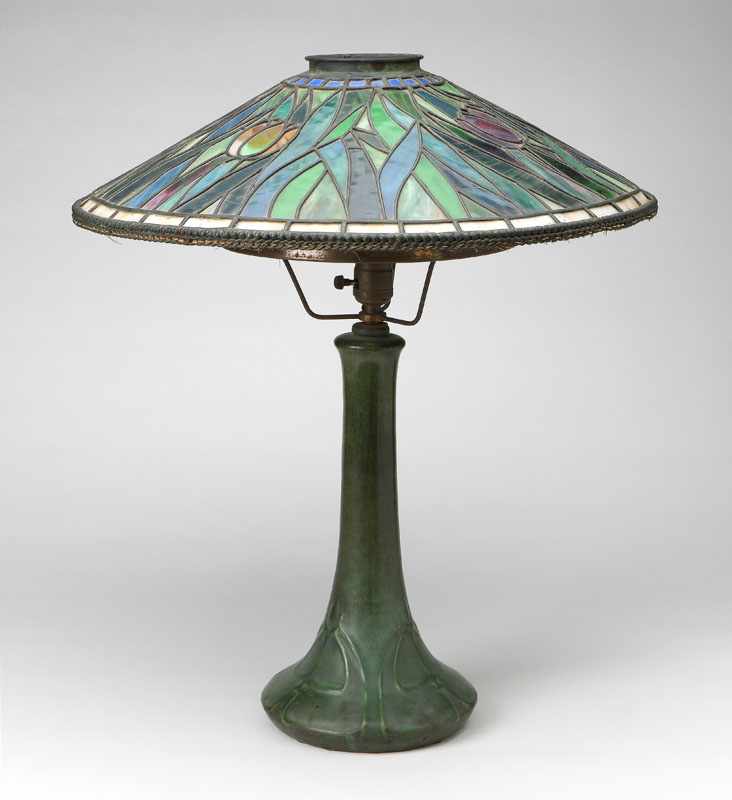 Appraisal: A Hampshire matte green-glazed art pottery lamp with leaded glass