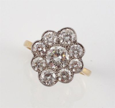 Appraisal: A diamond cluster ring The centre circular cut diamond is