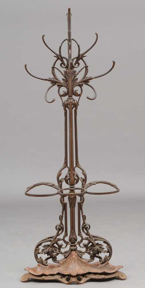 Appraisal: VICTORIAN CAST-IRON HALL TREE The pierced foliate back supporting five