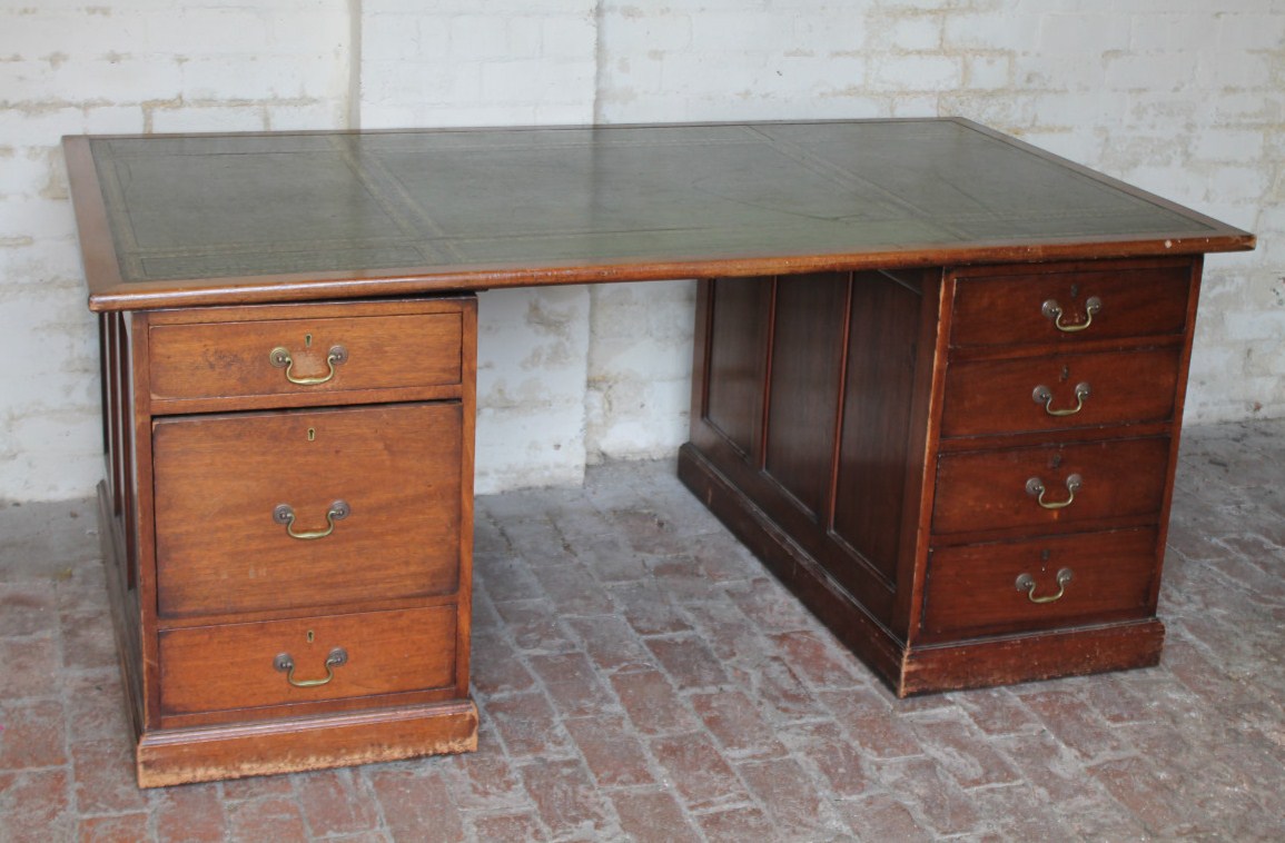 Appraisal: A thC mahogany partner's desk with a green gilt stencilled