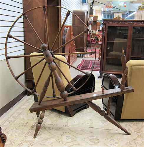 Appraisal: LARGE ANTIQUE SPINNING WHEEL th century a large ''great wheel''