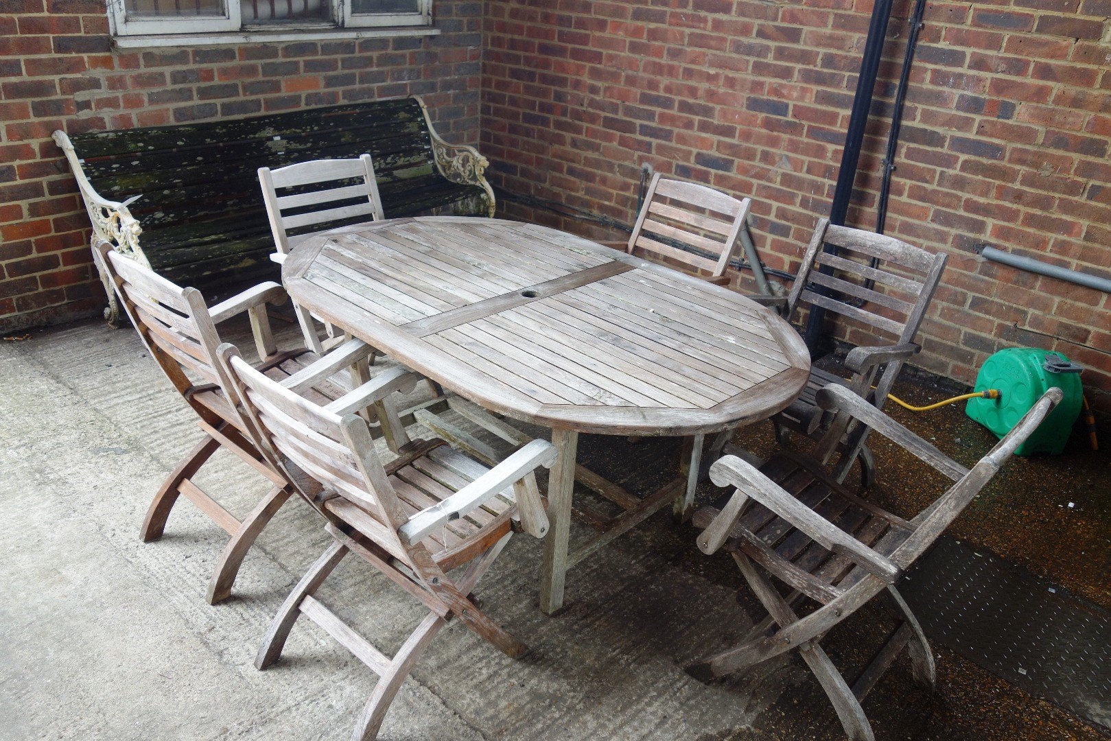 Appraisal: A th century hardwood oval garden table cm x cm