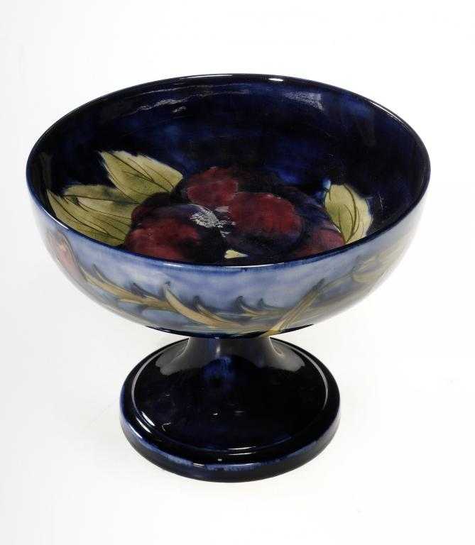 Appraisal: A MOORCROFT PANSY COUPE DESIGNED BY WILLIAM MOORCROFT cm h