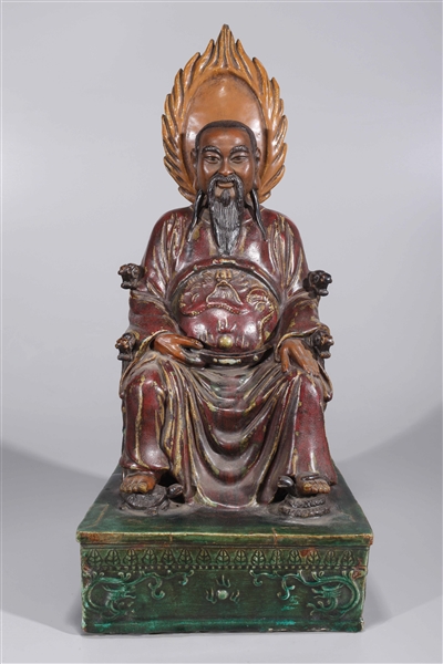 Appraisal: Chinese ceramic seated deity with flaming mandorla on base as-is