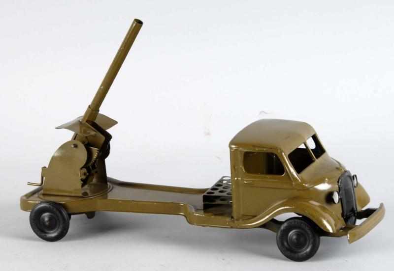 Appraisal: Pressed Steel Kingsbury Military Vehicle Toy Description American Wind-up mechanism