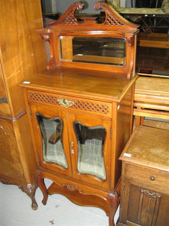 Appraisal: Late Victorian mahogany cabinet with raised mirrored back on cabriole