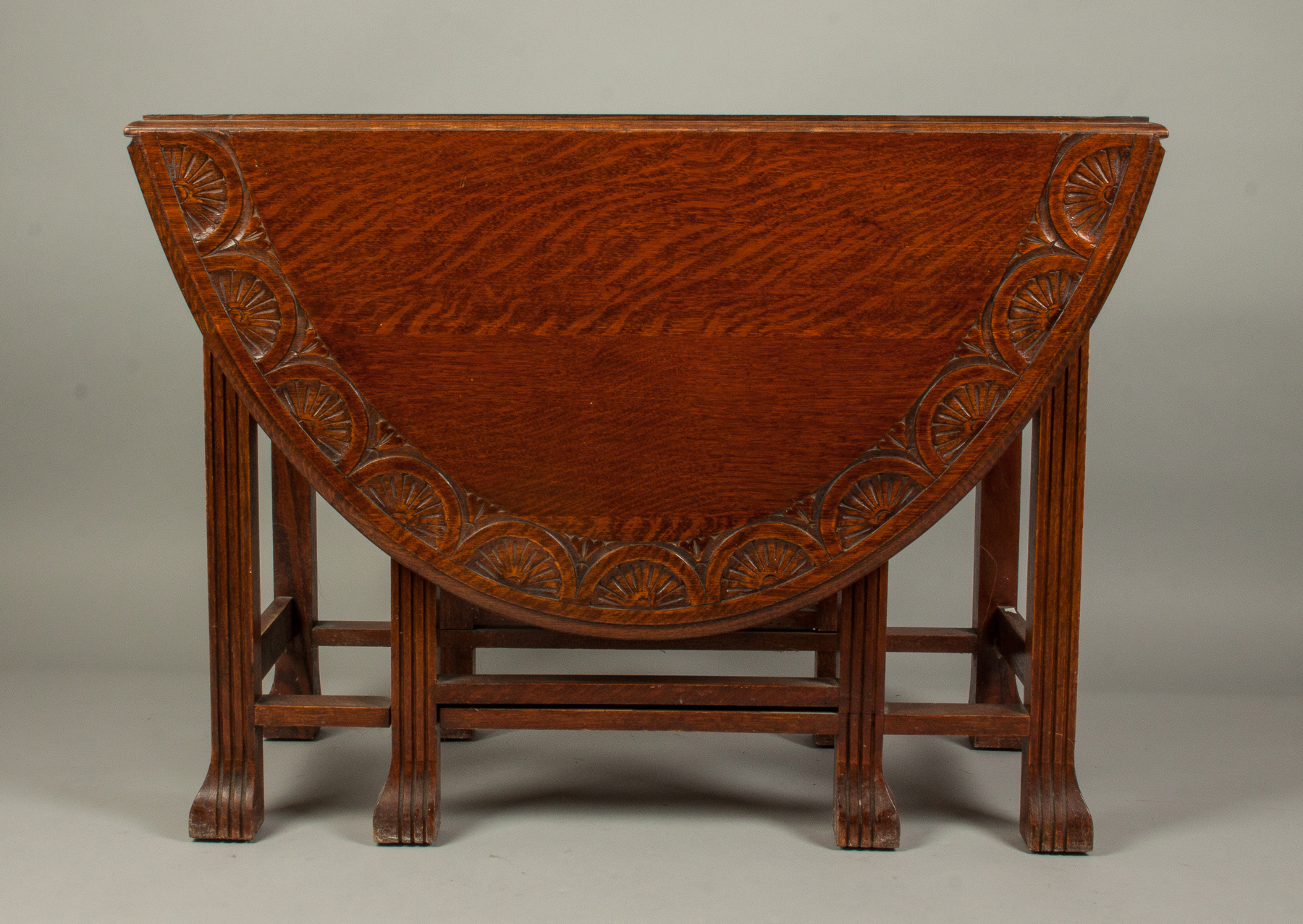 Appraisal: Carved Drop-Leaf Gate-Leg Table Quarter sawn oak Stylized legs carved