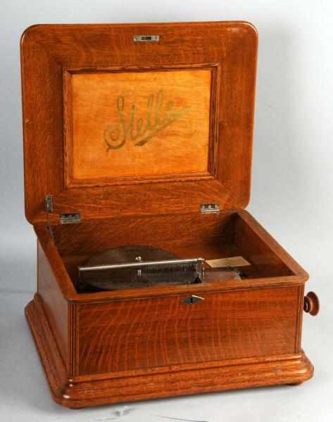 Appraisal: Wooden Stella Music Box in Oak Description Working Includes -