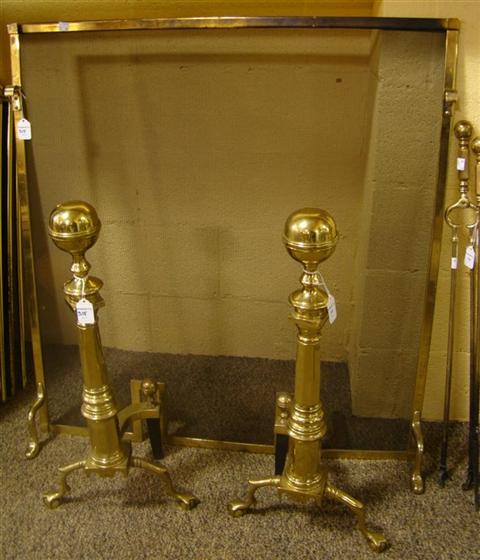 Appraisal: PAIR OF BRASS ANDIRONS AND FIRESCREEN The andirons with ball