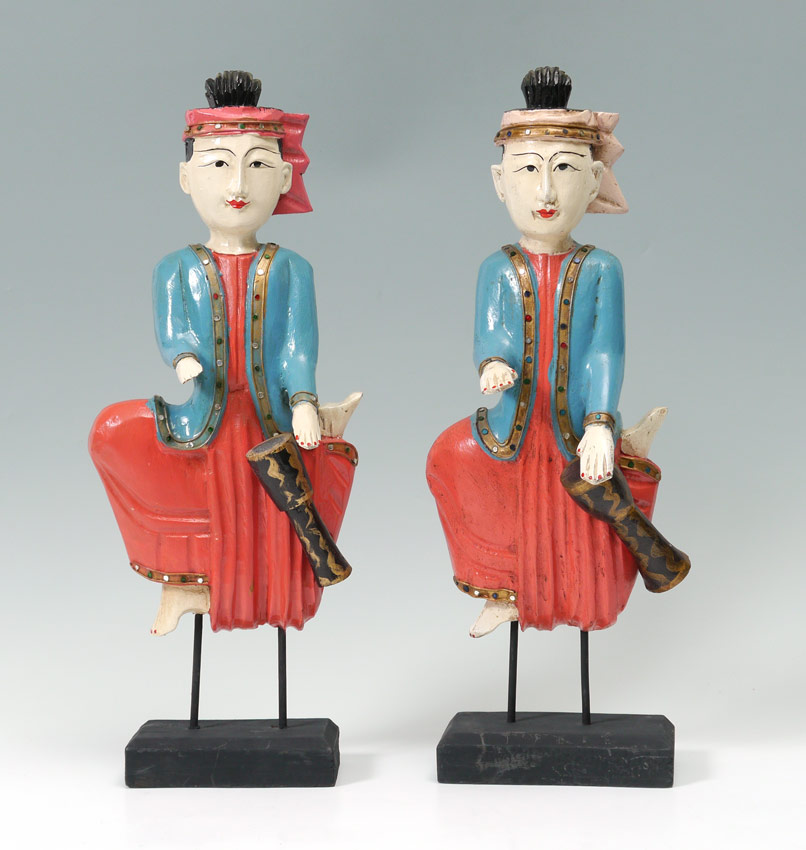 Appraisal: PAIR OF CARVED AND POLYCHROME FIGURES Each beating his own