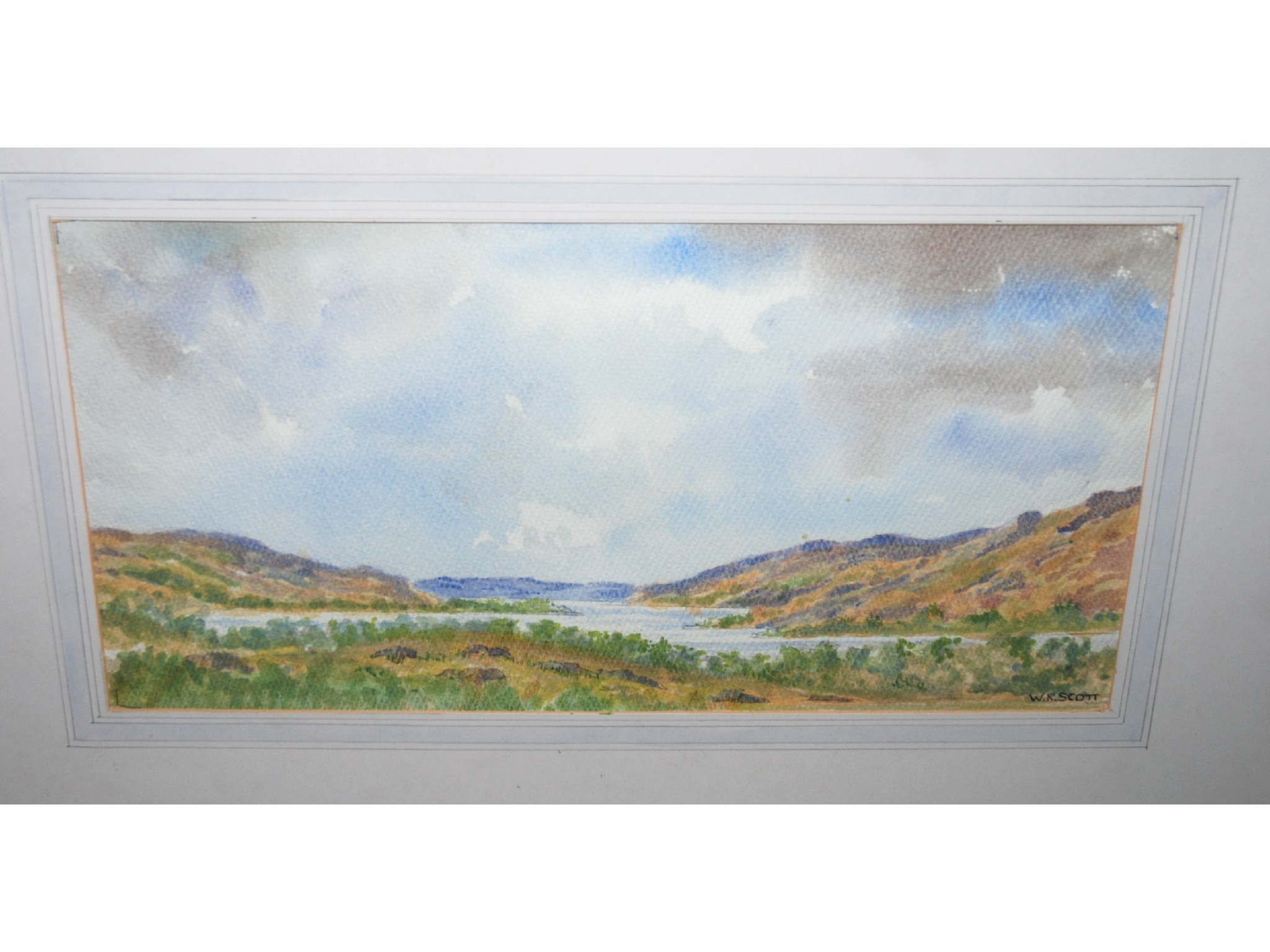 Appraisal: W R SCOTT Loch and mountains signed watercolour