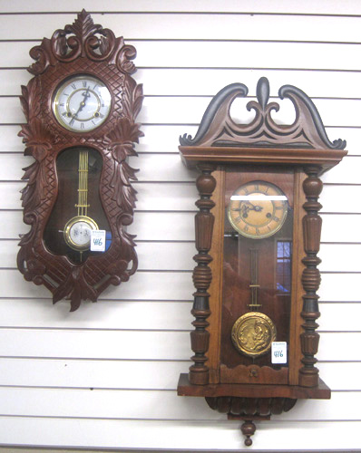 Appraisal: TWO TIME STRIKE WALL CLOCKS German walnut case by Schlenker