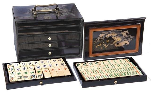 Appraisal: A MAHJONG SET bamboo and bone tiles and counters in